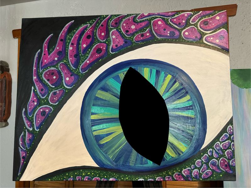 Work in progress of a large dragon eye with pink scales, a green and blue iris and a black pupil