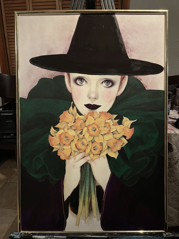 The same print painted over so the clown wears a tall black witch hat, dark lips and a green cloak