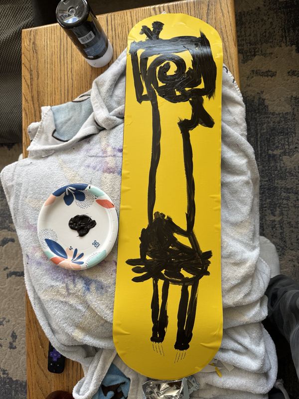 Yellow vinyl paint mask with black outline paint over it