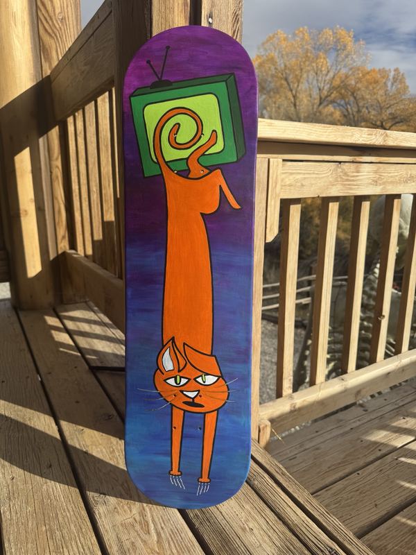 Deck with orange cat colored in, resting on a railing