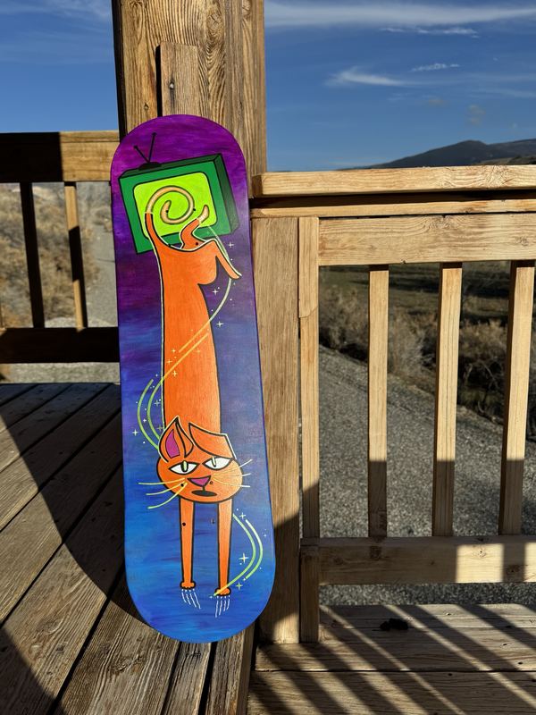 Finished orange cat with glowing swirls on a railing