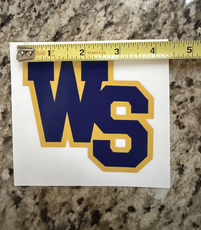 WS Mustangs decal in navy and gold lettering, held against a tape measure showing about 5 inches wide